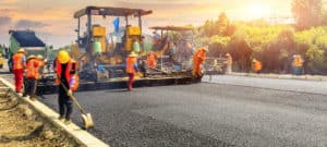 Construction workers building a road