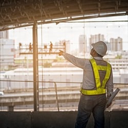 construction-worker-wearing-hard-hat-and-reflective-vest