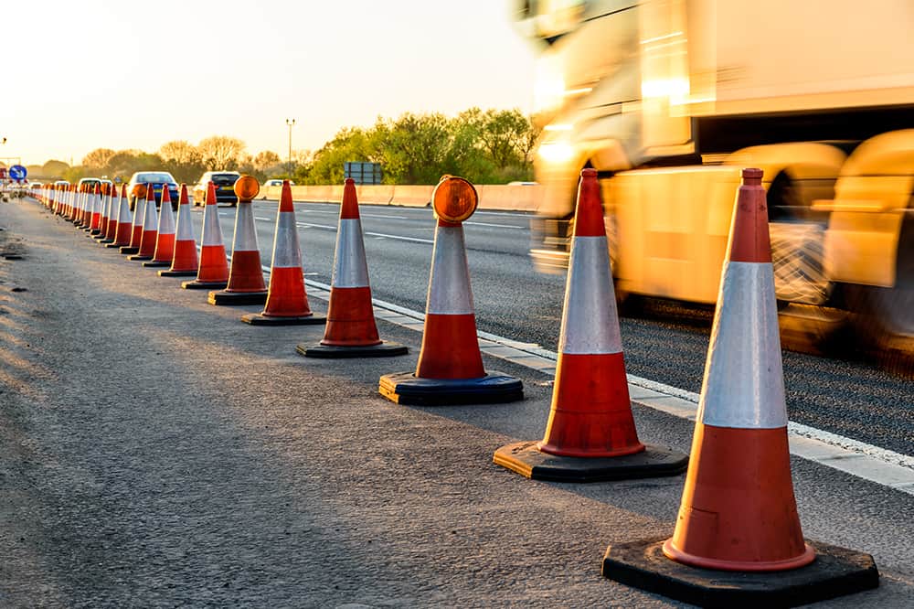 orange-construction-cones-on-freeway-highway